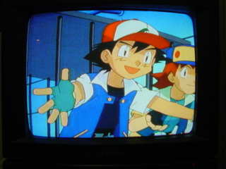 Ash and Richie ready to hug their Pikachu.